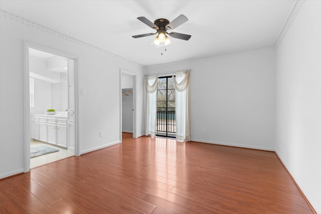 1518 S Gessner Rd, Houston, TX 77063 - empty room featuring ceiling fan, wood finished floors, crown molding, and baseboards
