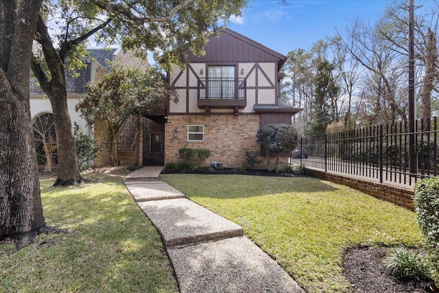 1518 S Gessner Rd, Houston, TX 77063 - tudor home with a balcony, brick siding, and stucco siding