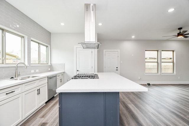 3337 Shelby Cir, Houston, TX 77051 - kitchen featuring a sink, appliances with stainless steel finishes, island range hood, a ceiling fan, and a kitchen island