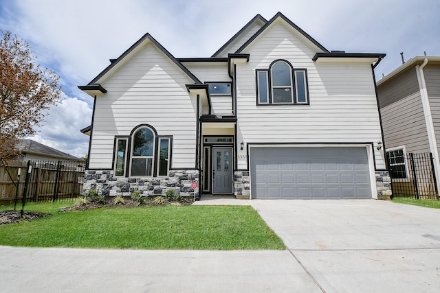 3337 Shelby Cir, Houston, TX 77051 - view of front of property with stone siding, a garage, and driveway