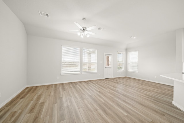 319 Riesling Dr, Alvin, TX 77511 - unfurnished living room featuring light wood-type flooring, baseboards, and a ceiling fan