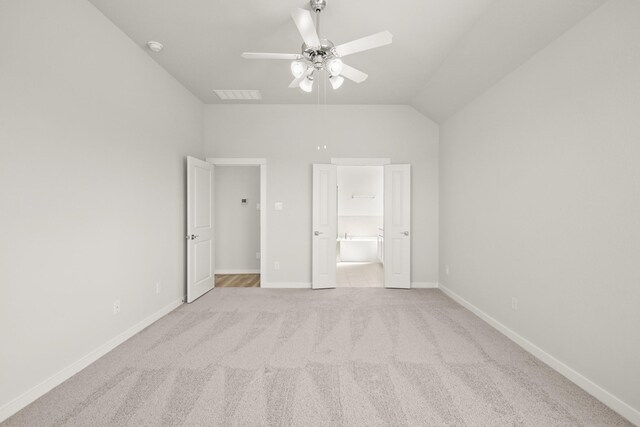 319 Riesling Dr, Alvin, TX 77511 - unfurnished bedroom featuring carpet flooring, connected bathroom, vaulted ceiling, and baseboards