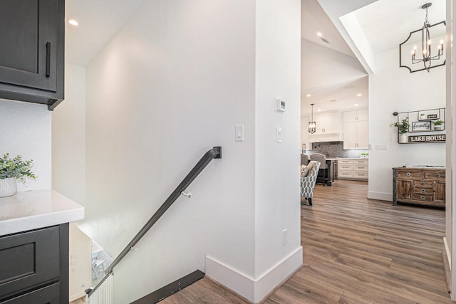 111 Seagull Path, Point Blank, TX 77364 - stairway featuring wood finished floors, a chandelier, recessed lighting, and vaulted ceiling