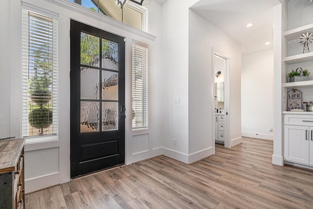 111 Seagull Path, Point Blank, TX 77364 - entrance foyer with light wood-style flooring and baseboards