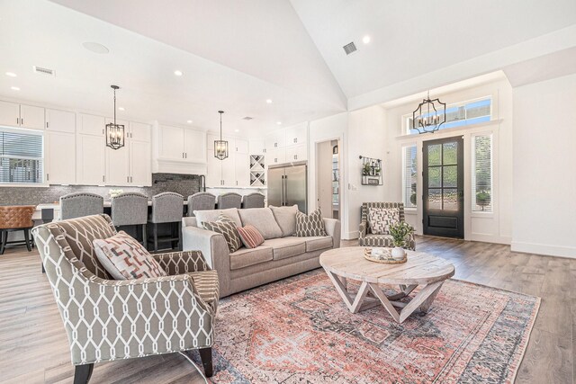 111 Seagull Path, Point Blank, TX 77364 - living room with a chandelier, light wood-style floors, recessed lighting, and high vaulted ceiling