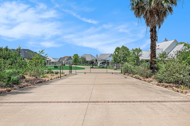 111 Seagull Path, Point Blank, TX 77364 - view of community featuring a gate and a residential view