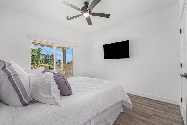 111 Seagull Path, Point Blank, TX 77364 - bedroom featuring wood finished floors, a ceiling fan, and access to outside