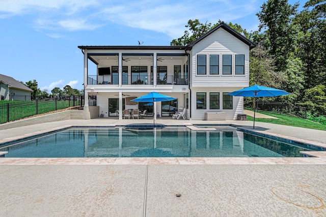 111 Seagull Path, Point Blank, TX 77364 - rear view of property featuring a balcony, ceiling fan, and a patio area