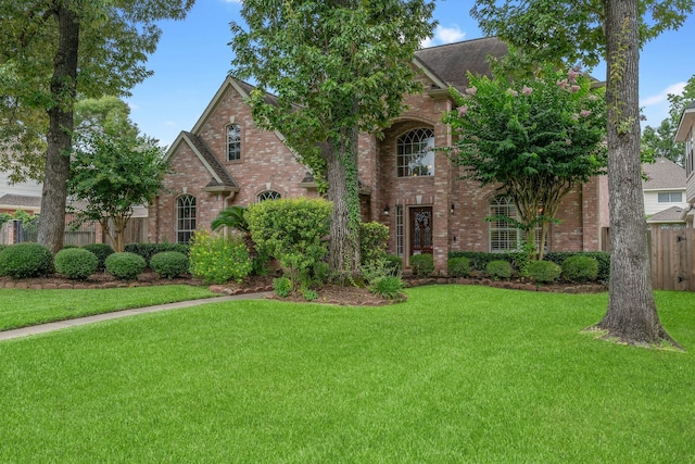 31335 Bearing Star Ln, Tomball, TX 77375 - traditional-style house featuring brick siding