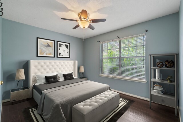31335 Bearing Star Ln, Tomball, TX 77375 - bedroom with dark wood-type flooring and a ceiling fan