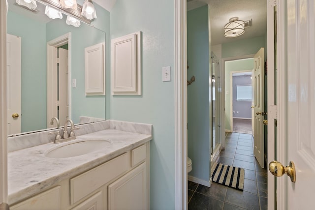 31335 Bearing Star Ln, Tomball, TX 77375 - bathroom with tile patterned flooring, vanity, and a shower stall