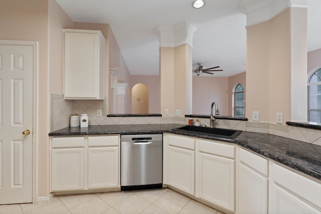 31335 Bearing Star Ln, Tomball, TX 77375 - kitchen featuring dishwasher, a ceiling fan, decorative backsplash, dark stone countertops, and light tile patterned flooring
