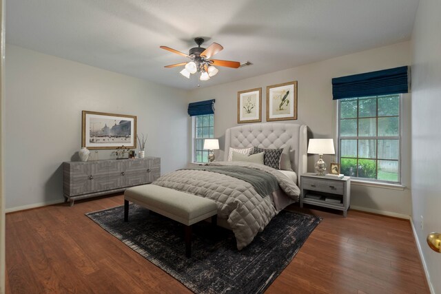 31335 Bearing Star Ln, Tomball, TX 77375 - bedroom with multiple windows, wood finished floors, and a ceiling fan