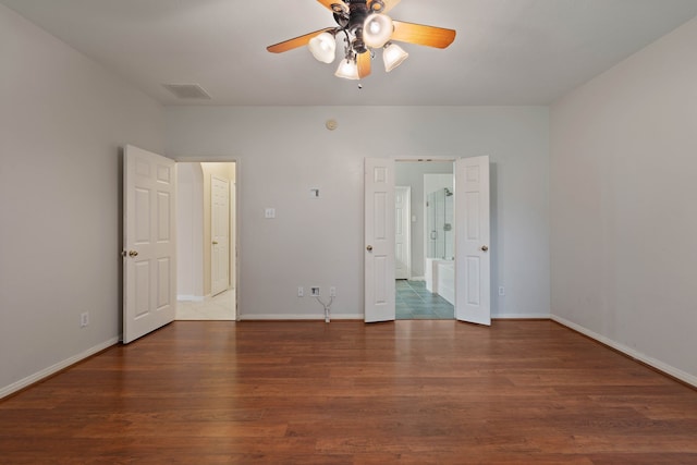 31335 Bearing Star Ln, Tomball, TX 77375 - unfurnished bedroom with wood finished floors and ceiling fan