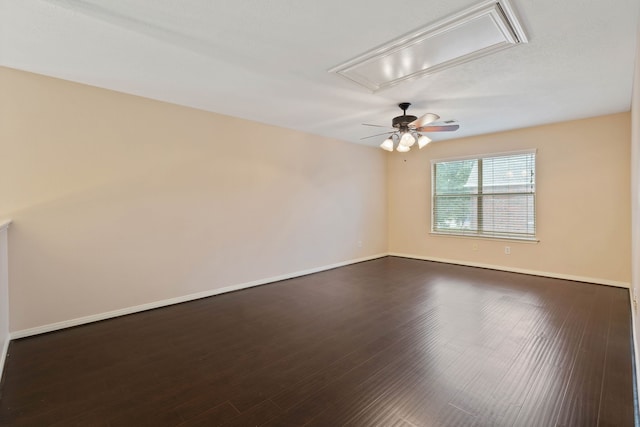 31335 Bearing Star Ln, Tomball, TX 77375 - empty room featuring attic access, a ceiling fan, and dark wood finished floors