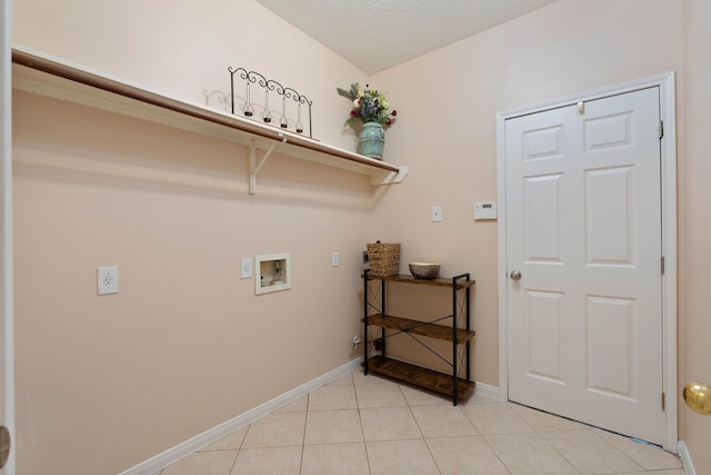 31335 Bearing Star Ln, Tomball, TX 77375 - washroom featuring washer hookup and light tile patterned floors
