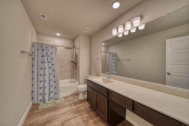 22168 Juniper Crossing Dr, New Caney, TX 77357 - full bath featuring wood finished floors, vanity, shower / tub combo with curtain, a textured ceiling, and toilet