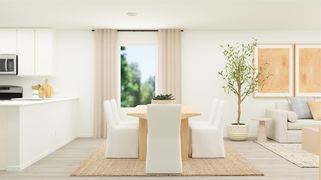 3064 Wild Dunes Dr, Katy, TX 77493 - dining area with light wood-style flooring and baseboards