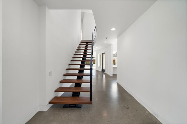 1518 Bayram Dr, Houston, TX 77055 - stairway featuring baseboards and recessed lighting