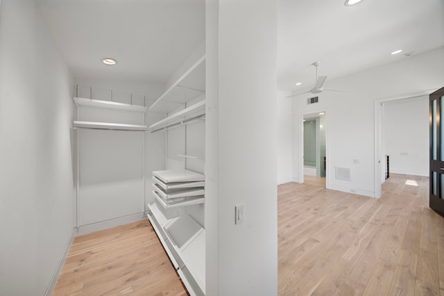 1518 Bayram Dr, Houston, TX 77055 - walk in closet with light wood finished floors and ceiling fan
