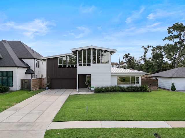 1518 Bayram Dr, Houston, TX 77055 - view of front of home featuring a garage, driveway, and a sunroom