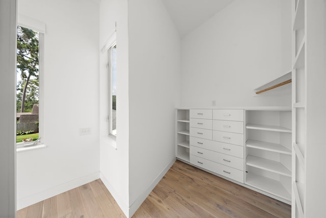 1518 Bayram Dr, Houston, TX 77055 - spacious closet featuring light wood-type flooring and lofted ceiling