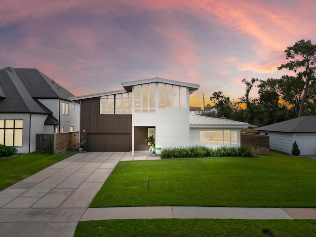 1518 Bayram Dr, Houston, TX 77055 - modern home with a garage, driveway, a front lawn, and a metal roof