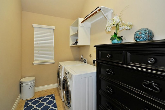 22419 Slate Oaks Ln, Richmond, TX 77469 - washroom featuring washing machine and clothes dryer, light tile patterned floors, and baseboards
