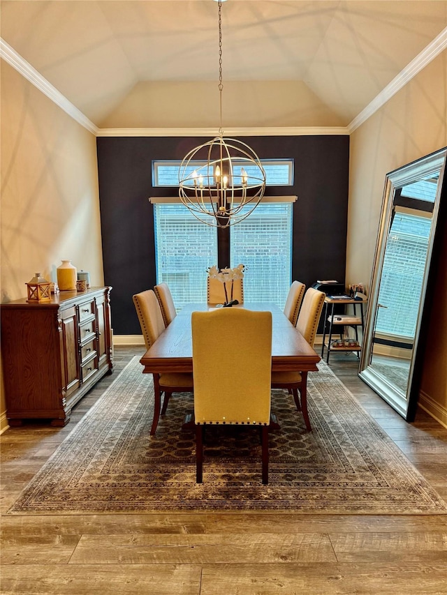 22419 Slate Oaks Ln, Richmond, TX 77469 - dining room featuring a chandelier, wood-type flooring, vaulted ceiling, healthy amount of natural light, and crown molding