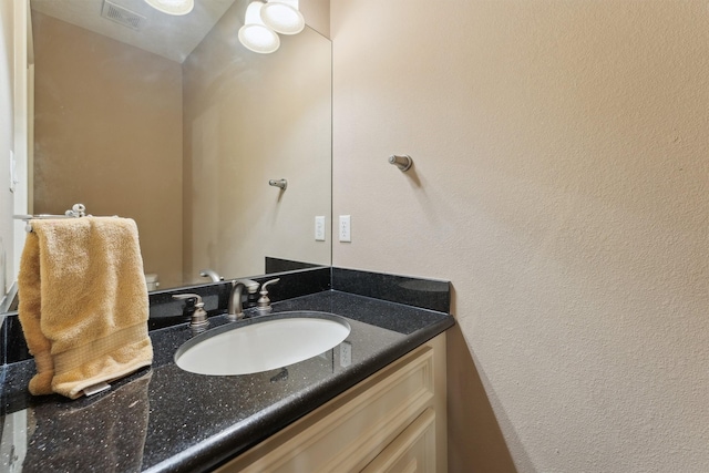 1215 Malone St, Houston, TX 77007 - bathroom with vanity and a textured wall
