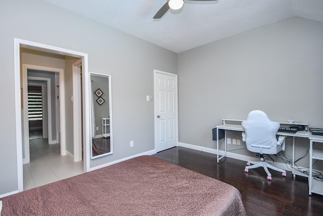 7103 Adobe Meadows Ct, Sugar Land, TX 77479 - bedroom with baseboards, a ceiling fan, wood finished floors, and vaulted ceiling