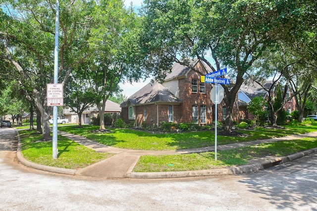 7103 Adobe Meadows Ct, Sugar Land, TX 77479 - view of front of house with brick siding and a front lawn