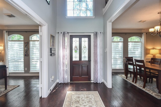 7103 Adobe Meadows Ct, Sugar Land, TX 77479 - entryway with a chandelier, hardwood / wood-style flooring, and baseboards