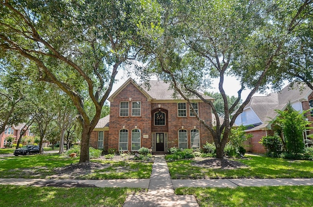 7103 Adobe Meadows Ct, Sugar Land, TX 77479 - view of front facade with brick siding and a front lawn