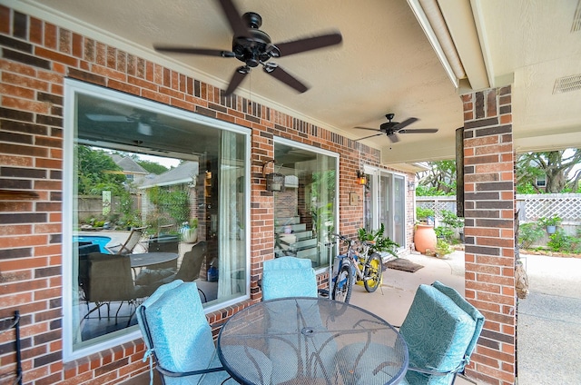 7103 Adobe Meadows Ct, Sugar Land, TX 77479 - view of patio featuring ceiling fan and outdoor dining space