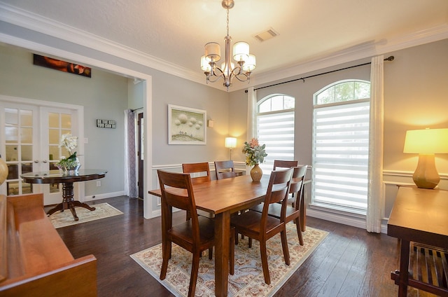 7103 Adobe Meadows Ct, Sugar Land, TX 77479 - dining space featuring a chandelier, ornamental molding, wood finished floors, and french doors