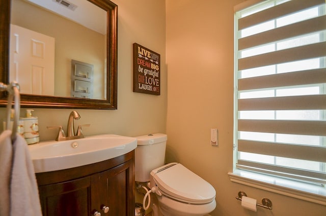 7103 Adobe Meadows Ct, Sugar Land, TX 77479 - bathroom featuring plenty of natural light, toilet, and vanity