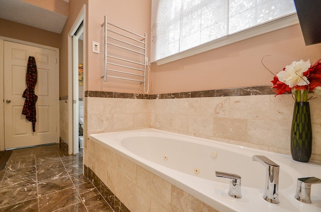 7103 Adobe Meadows Ct, Sugar Land, TX 77479 - full bathroom featuring a tub with jets, toilet, a towel warming rack, radiator heating unit, and marble finish floors