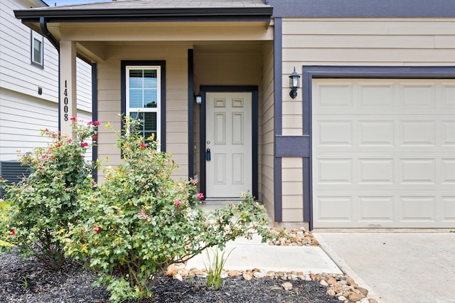 14008 Paddlefish Dr, Conroe, TX 77384 - doorway to property with an attached garage and driveway