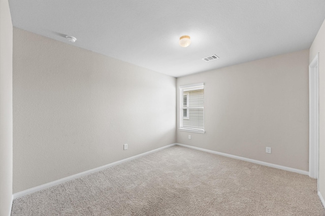 14008 Paddlefish Dr, Conroe, TX 77384 - carpeted spare room with baseboards and a smoke detector
