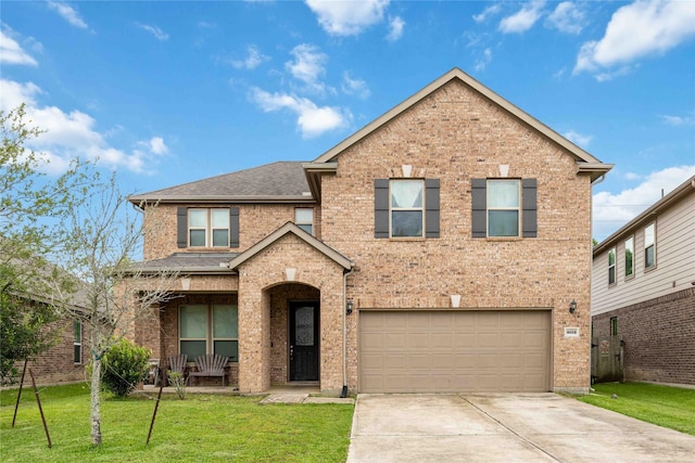 14008 Harmony Ridge Trl, Pearland, TX 77584 - traditional home featuring concrete driveway, a garage, a front lawn, and brick siding