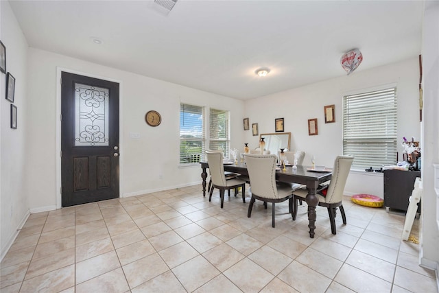 14008 Harmony Ridge Trl, Pearland, TX 77584 - dining room featuring light tile patterned flooring and baseboards
