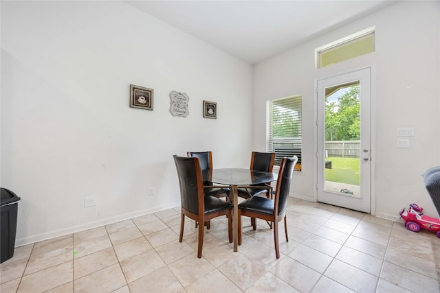 14008 Harmony Ridge Trl, Pearland, TX 77584 - dining area with baseboards and light tile patterned flooring