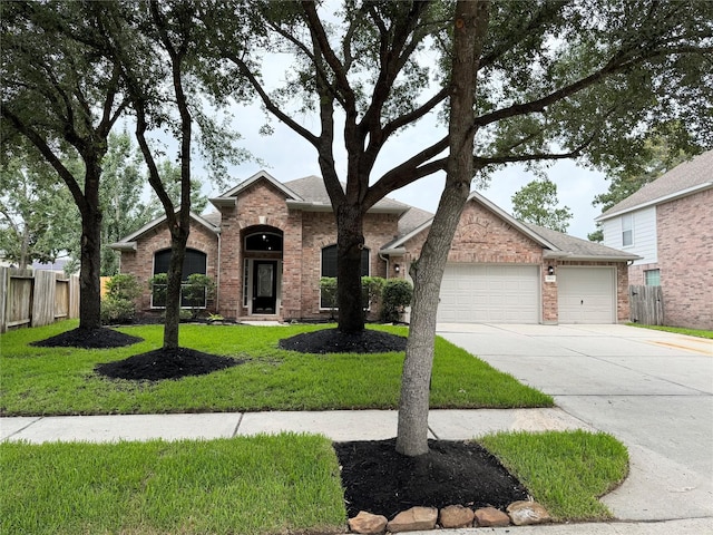 30611 Pinemill Hollow Dr, Spring, TX 77386 - view of front of property with an attached garage, driveway, and brick siding