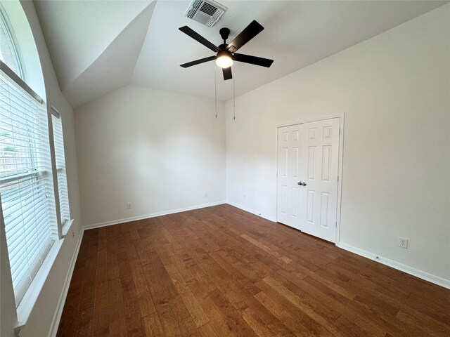 30611 Pinemill Hollow Dr, Spring, TX 77386 - unfurnished room featuring dark wood-style flooring, lofted ceiling, a ceiling fan, and baseboards