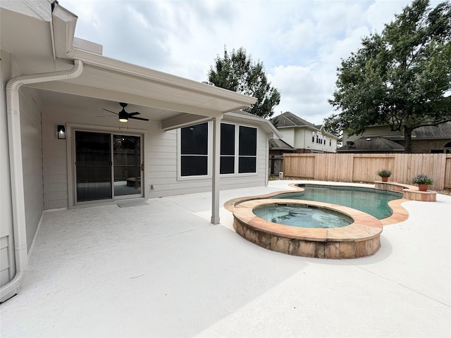 30611 Pinemill Hollow Dr, Spring, TX 77386 - view of swimming pool with an in-ground hot tub, ceiling fan, a patio area, and a fenced backyard