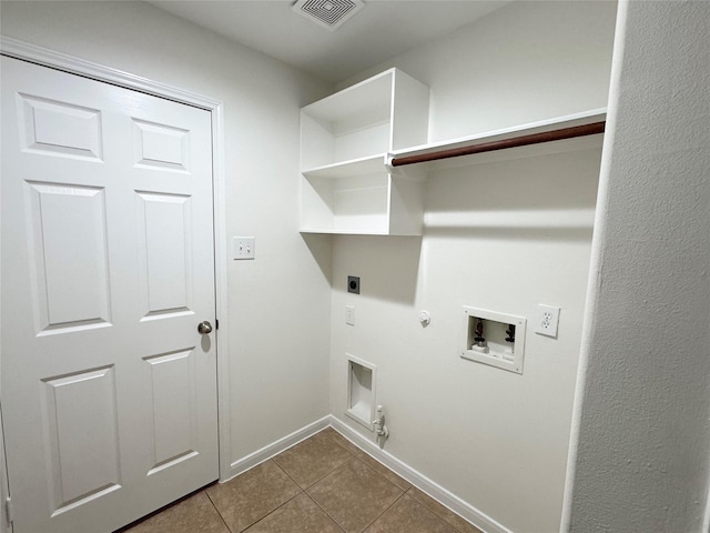 30611 Pinemill Hollow Dr, Spring, TX 77386 - washroom with hookup for a gas dryer, hookup for an electric dryer, tile patterned flooring, hookup for a washing machine, and baseboards