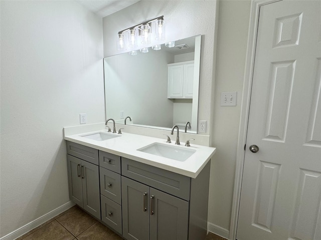 30611 Pinemill Hollow Dr, Spring, TX 77386 - bathroom featuring double vanity, tile patterned flooring, and baseboards