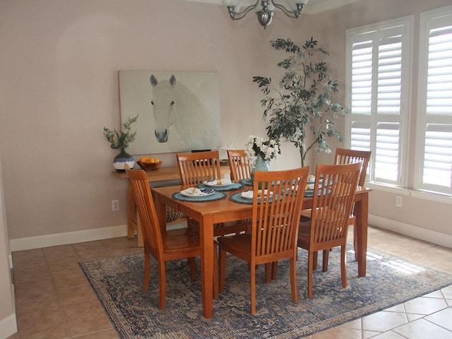 2862 Dees Cir, Sealy, TX 77474 - dining space with tile patterned floors, a chandelier, and baseboards