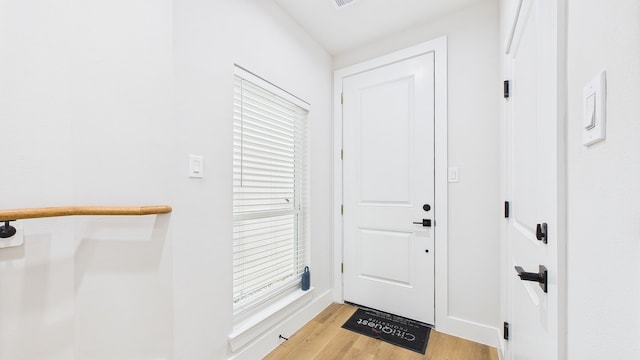 1813 Brooks St, Houston, TX 77026 - entryway featuring light wood-style floors and baseboards